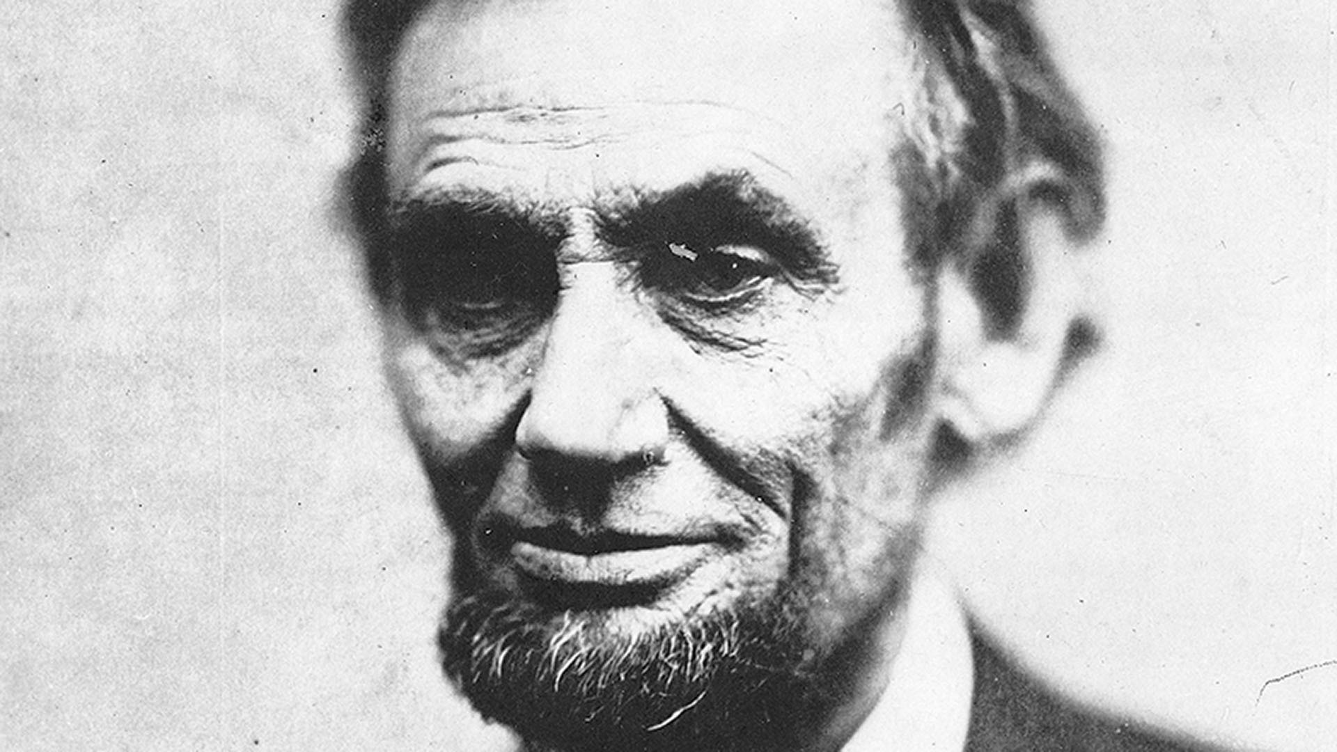 A black-and-white photo showing a close-up of Abraham Lincoln's face, circa spring 1865.