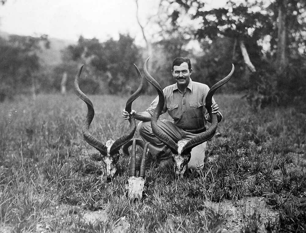 Ernest Hemingway with kudu heads