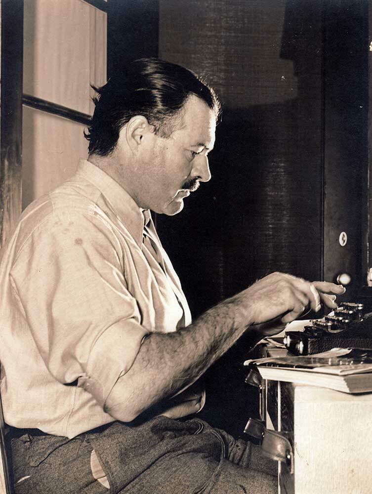 Ernest Hemingway on his typewriter