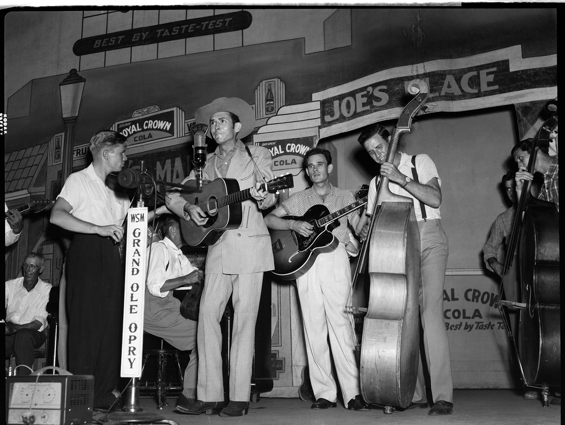 Closeup image of Hank Williams on the Grand Ole Opry at the Ryman Auditorium