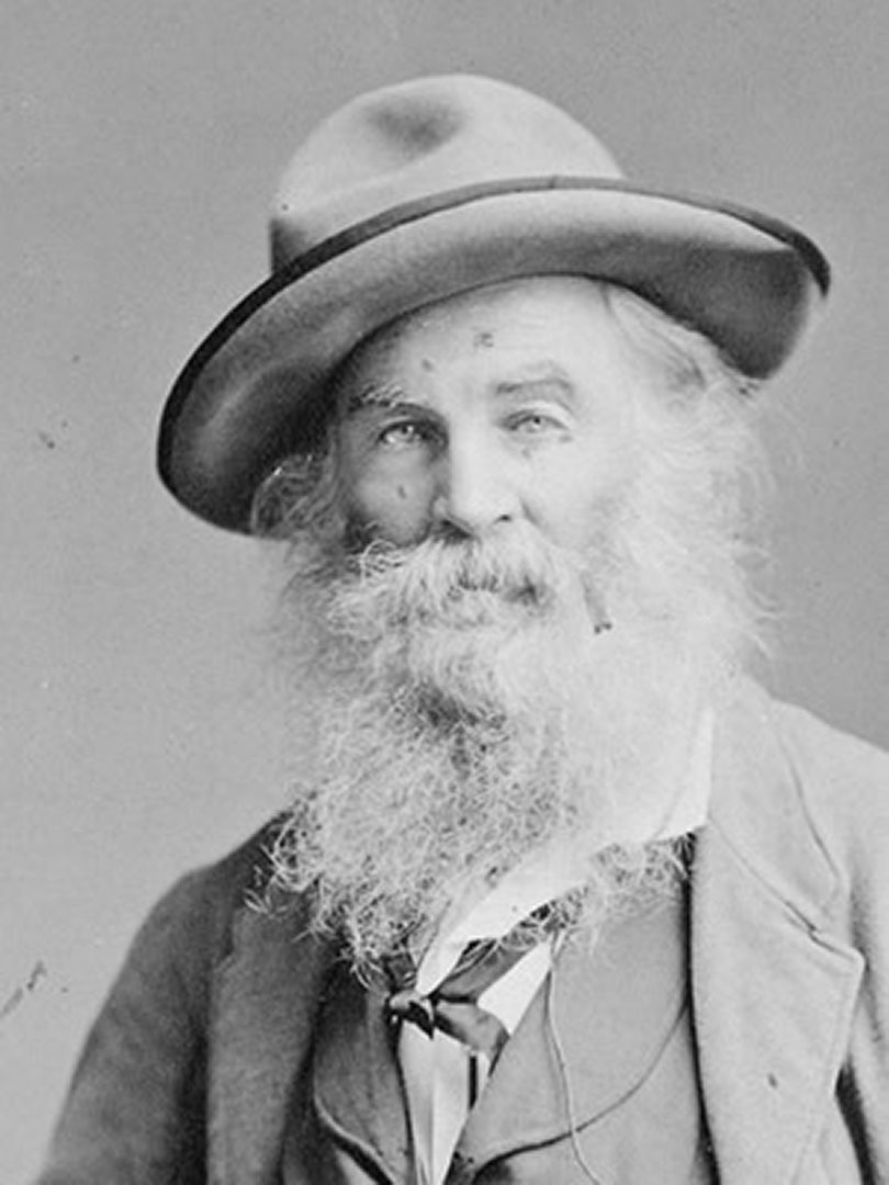 A black-and-white photo of Walt Whitman.